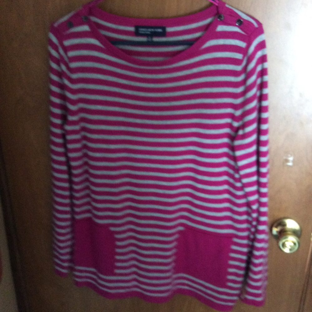 Woman’s pink and gray stripe sweater